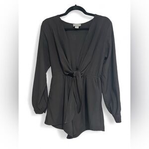Black wrap jumper with open sleeves at sides from shoulder down to cuffs.